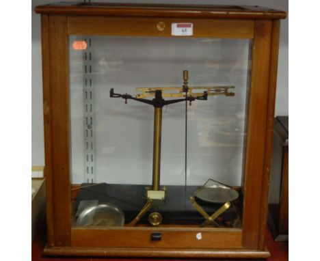 A set of mid 20th century brass laboratory scales in fitted teak glazed case, bearing label for Philip Harris Ltd of Birmingh