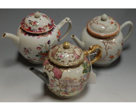 *An 18th century Chinese porcelain bullet shaped teapot, typically enamel decorated with various flowers having old rivet rep