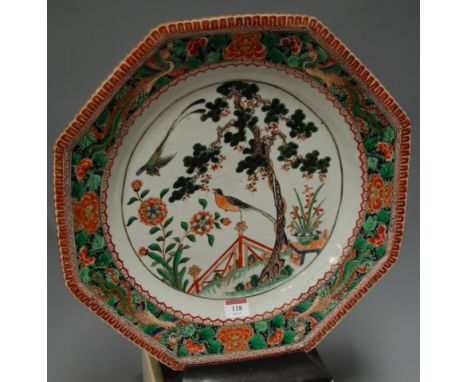 *A large 18th century Chinese charger, the central panel enamel decorated with birds amongst foliage within further floral bo