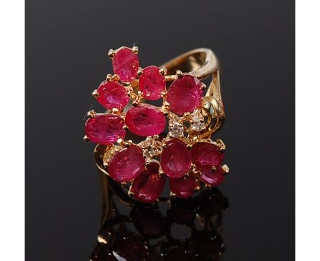 A contemporary 14ct gold ruby and diamond point set cluster ring 5.2g, size N