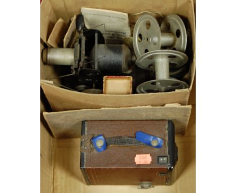 An early 20th century German tinplate projector/magic lantern together with a box of Primus magic lantern slides, and a Kodak