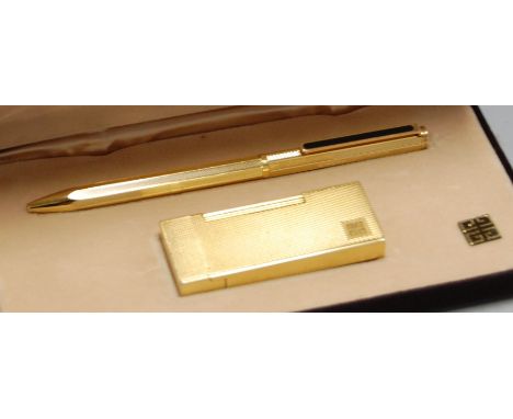 A modern Givenchy textured gilt pocket cigarette lighter together with a matching ballpoint pen in fitted case