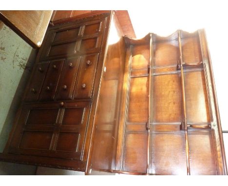 Ercol oak dresser with two tier raised back above four central drawers and two cupboard doors 