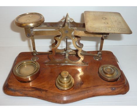 Set of brass office scales on walnut base
