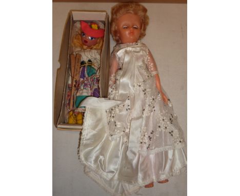 Boxed Pelham puppet and celluloid doll