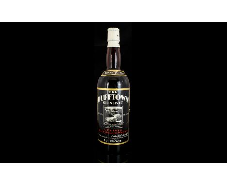 Dufftown - Glenlivet 8 Year Old Bottle of Deluxe Scotch Malt Whiskey, Bottled In The 1960's era at 80 % Proof. Description Ho