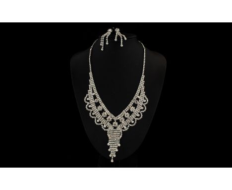 White Austrian Crystal Chandelier Necklace and Drop Earrings, a decorative statement necklace with rows, flowers and loops of