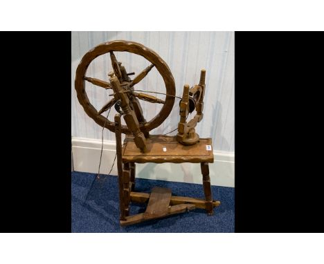 A Display Purposes Spinning Wheel Model of spinning wheel in varnished beech wood. Height, 34 inches.  