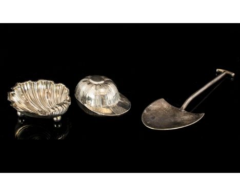 A Novelty Caddy Spoon In The Form Of A Jockey's Cap Fully hallmarked, together with an Edwardian silver salt in the form of a