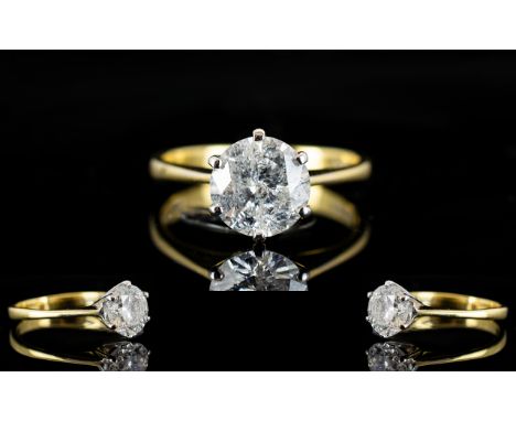 An 18ct Gold Single Stone Diamond Ring Set with a round modern brilliant cut diamond in six claw setting. Fully hallmarked, c