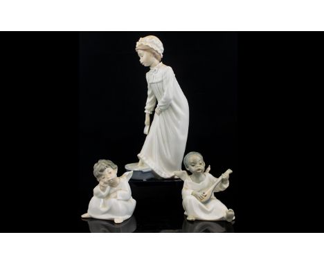 Lladro A Pair Of Cherub Figures The first in pensive pose, the second, playing a lute. Along with a Nao figure in the form of