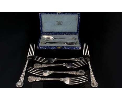 Boxed Sterling Silver Cutlery Set Housed in original fitted box comprising  spoon and cake fork of plain form with Celtic kno