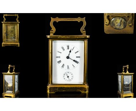 English Late 19th Century Brass Cased Carriage Clock with Alarm Facility Glass Panels, Visible Open Lever Escapement, Porcela