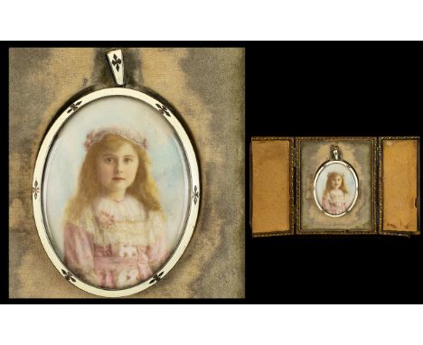 A Late Victorian/Edwardian Portrait Miniature Depicting a young girl painted on ivory, housed in a silver enamelled frame, no