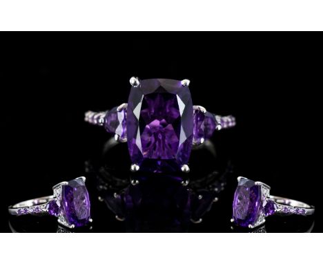 Amethyst Cushion and Trillion Cut Ring, a 6ct elongated cushion cut, regal purple amethyst, set with a trillion cut similar a