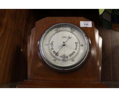 AN ART DECO OAK DESK TOP BAROMETER 