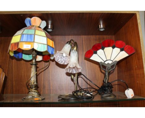 A TIFFANY STYLE TABLE LAMP WITH MULTICOLOURED LEADED GLASS SHADE, TOGETHER WITH AN ART DECO STYLE EXAMPLE IN THE FORM OF A FE