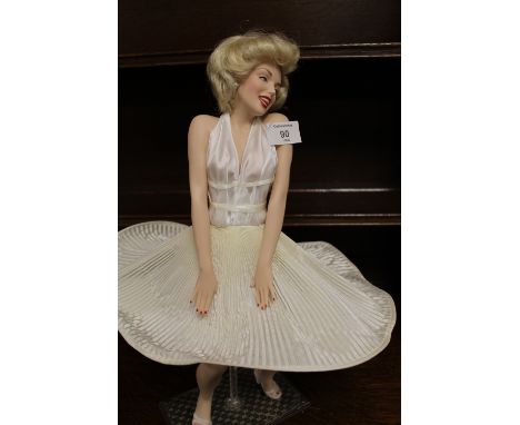 A CERAMIC FIGURE OF MARILYN MONROE ON STAND - H 43 CM