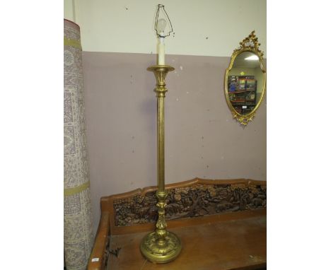 A CARVED AND GILT LAMP STANDARD