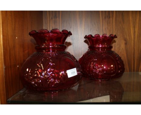 A PAIR OF RUBY GLASS OIL LAMP SHADES, base Dia. - internal approx 9 cm, external approx 10 cm, H 20 cmCondition Report:Small 