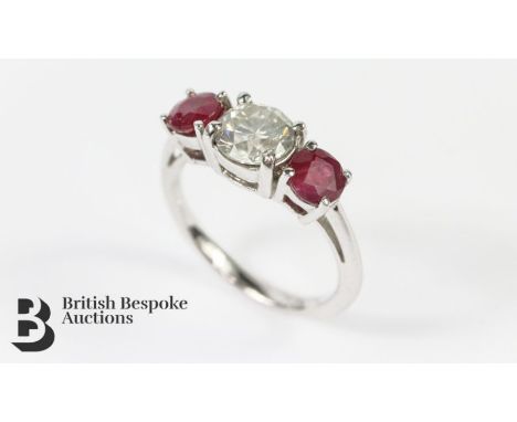 18ct white gold three stone ruby and diamond ring, set with approx 1.5 cts of dias, size L, approx 3.35 gms.&nbsp;