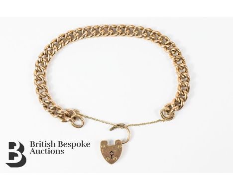 9ct gold link bracelet, with a 9ct gold heart lock, approx 19l cms in length, complete with safety chain, approx 16.8 gms.&nb