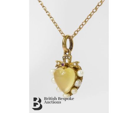 Gold heart-shaped pendant, set with a central heart-shaped moonstone surrounded by twelve pearls and a central ruby, approx 1