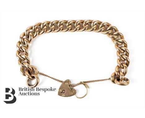 9ct gold link bracelet, with a 9ct gold heart lock, approx 20l x 10w cms in length, complete with safety chain, approx 25.8 g