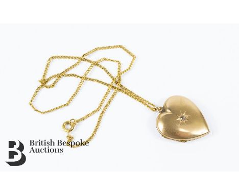 15ct gold heart-shaped locket, set with with a central rose-cut diamond approx 1.5 pts, 4.2 gms, suspended from a 9ct fine ch