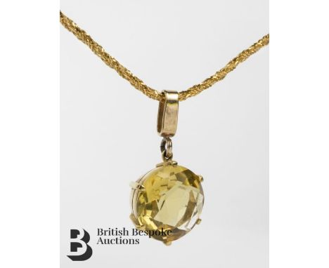 18ct yellow gold chain, approx 47 cms in length, approx 6.97 gms together with a 9ct gold citrine pendant, approx 14 mm diame