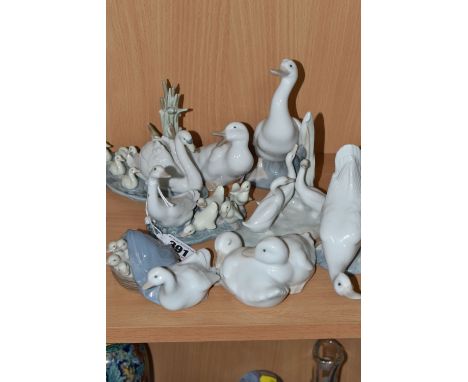 A GROUP OF EIGHT LLADRO AND NAO DUCK FIGURINES, comprising Lladro model number 4895, Lladro 'Swan and Cygnets' model number 5