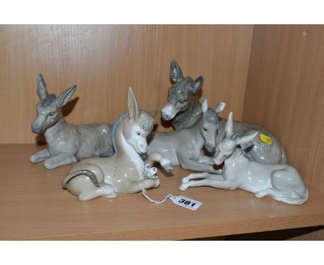 A GROUP OF FIVE LLADRO DONKEYS, comprising Nativity Donkey model number 1389, a small Nao Nativity Donkey (reglued right ear)