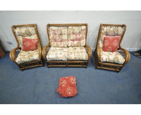 A WICKER THREE PIECE CONSERVATORY SUITE, comprising a two seater sofa, length 126cm x depth 91cm x height 101cm, along with a