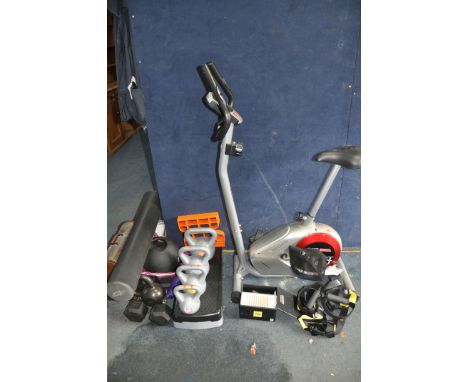 A COLLECTION OF FITNESS EQUIPMENT including a Techfit spin cycle, a fitness ball, a step, seven weights from 12kg down to 2kg