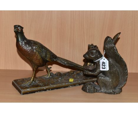 A CAST METAL SQUIRREL NUT CRACKER AND A COLD PAINTED TABLE LIGHTER/STRIKER, comprising a cold painted spelter pheasant table 