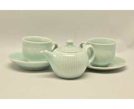 DEREK EMMS (1929-2004) PALE BLUE TEA WARES, comprising a teapot with two cups and saucers, all with impressed marks, Conditio