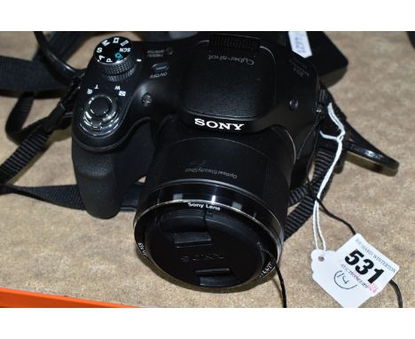 A SONY DSC-H400 CYBERSHOT BRIDGE CAMERA, 20.1 MEGAPIXELS, fitted with a 63x zoom lens, comes with a battery and battery charg