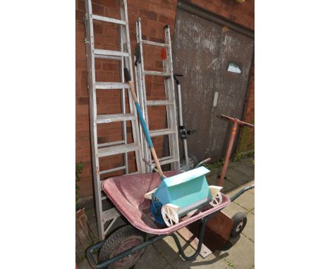 TWO ALUMINIUM STEP LADDERS , a builders barrow, a brick trolley etc