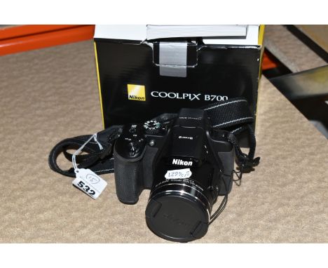 A NIKON B700 20.3 MEGAPIXEL BRIDGE CAMERA, fitted with a 60x optical zoom lens, complete with instruction book and tatty box,