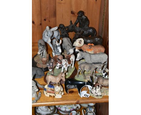 A GROUP OF DONKEY ORNAMENTS, comprising a Polish  mid 20th century Cmielów stylised donkey numbered 5073/268, a Rionda donkey