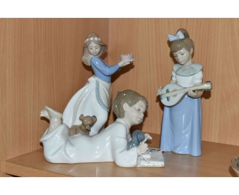 THREE NAO FIGURES, comprising Repeat After Me no 1285, Puppy's Birthday no 1045 and Girl With Mandolin no 1033 (3) (Condition