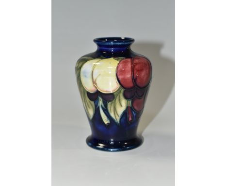 A MOORCROFT POTTERY WISTERIA PATTERN VASE, the shouldered vase tube lined with yellow, pink and purple wisteria flowers on a 