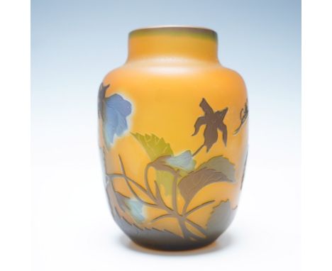 Beautifully crafted cameo glass vase in the style of Emile Galle, featuring an amber-hued background adorned with intricate a