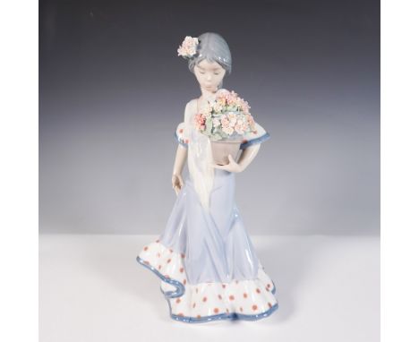 Issued in 1988 and retired in 2007, Flor Maria by Lladro is a graceful porcelain figurine sculpted by Juan Huerta. Featuring 