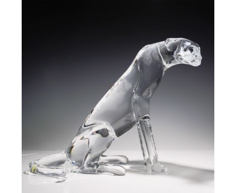 A striking Baccarat crystal sitting cheetah sculpture, showcasing the elegance and craftsmanship of the renowned French cryst