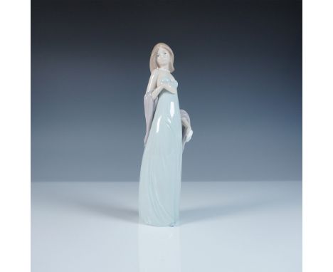 A stunning Lladro porcelain figurine, Ingenue, model number 1005487, sculpted by Jose Puche. This elegant piece captures the 