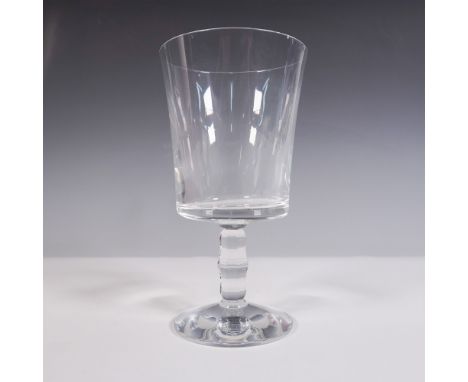 A clear crystal wine glass featuring a plain, squarish bowl and a faceted wafer stem. The base is etched with the Baccarat lo