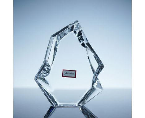 A striking Baccarat Iceberg crystal sculpture featuring a bold geometric design with angular cuts that capture and reflect li