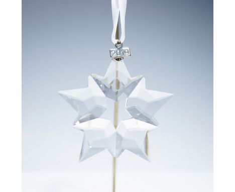 2019 annual edition Swarovski crystal ornament featuring a six-pointed star design, crafted in clear crystal. The ornament is