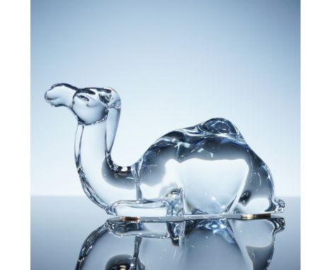 Clear crystal camel figurine by Baccarat, capturing the gentle slope of the hump and elongated neck in a sleek, stylized form